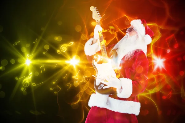 Santa spelen gitaar — Stockfoto