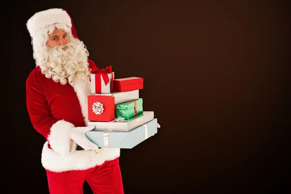 Padre Navidad celebración de muchos regalos — Foto de Stock