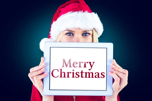 Festive blonde holding a tablet pc — Stock Photo, Image