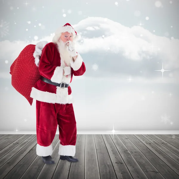 Composite image of santa keeping a secret — Stock Photo, Image