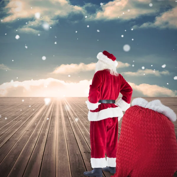 Happy santa with sack of gifts — Stock Photo, Image