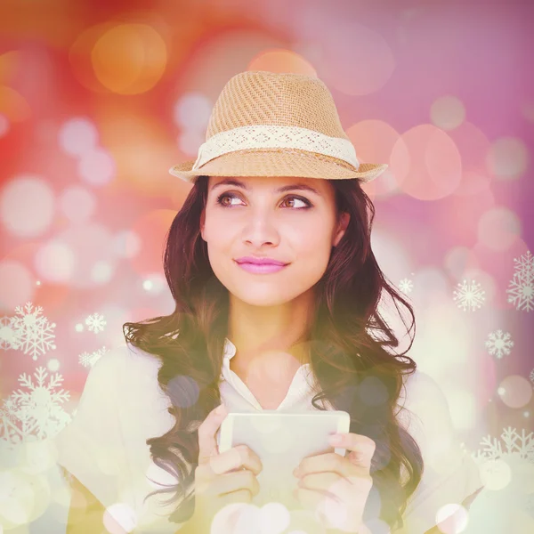 Pretty brunette holding her phone — Stock Photo, Image