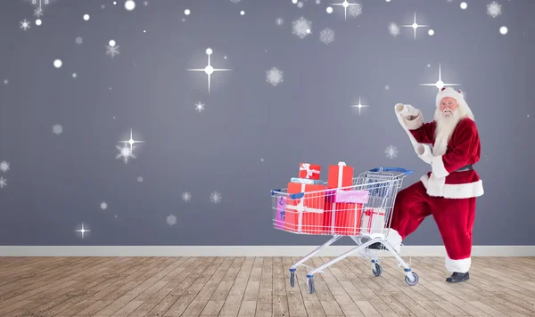 Santa entrega de regalos desde el carrito — Foto de Stock