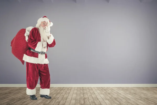 Composite image of santa keeping a secret — Stock Photo, Image