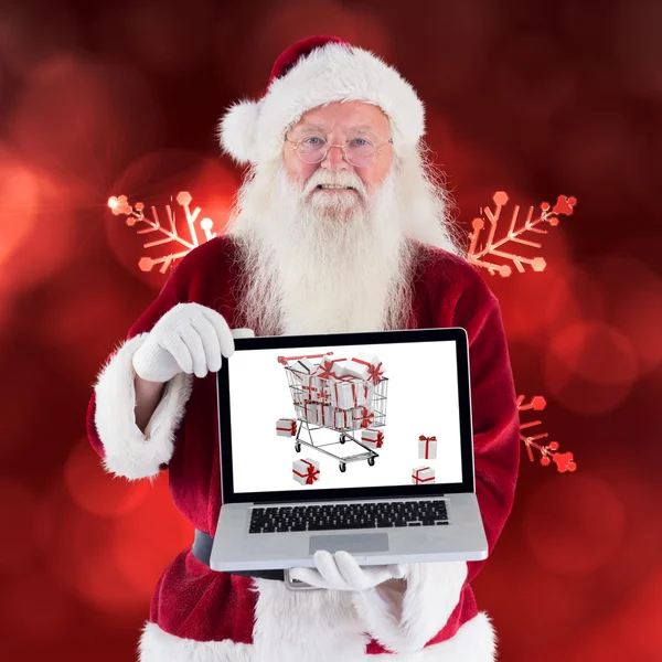 Santa Claus presenteert een laptop — Stockfoto