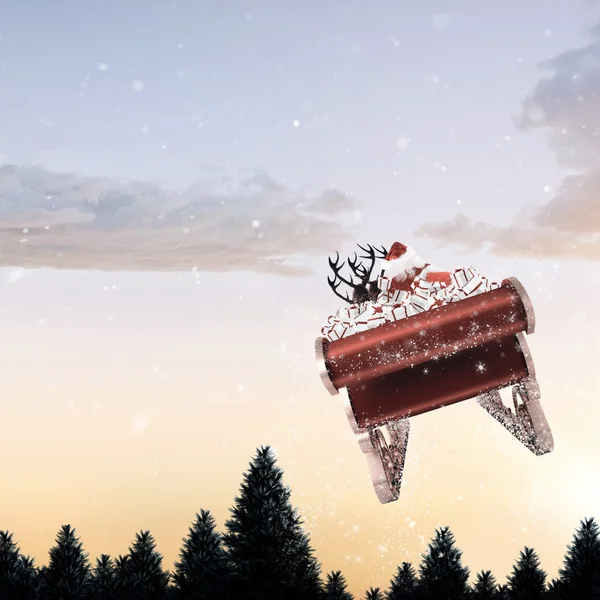 Image composite du Père Noël volant sur son traîneau — Photo