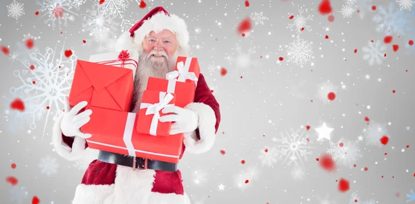 Santa carries a few presents — Stock Photo, Image