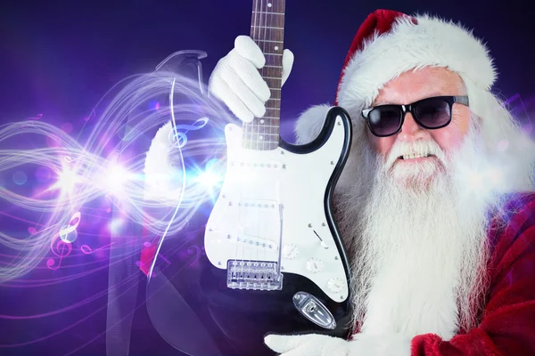 Father christmas shows a guitar — Stock Photo, Image