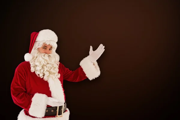 Retrato de Papai Noel mostrando — Fotografia de Stock