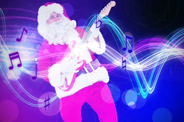 Sorrindo santa tocando guitarra elétrica — Fotografia de Stock