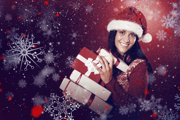 Young brunette with many christmas presents — Stock Photo, Image