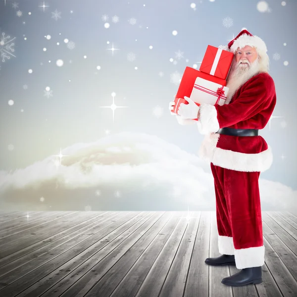 Santa hediyeler taşıyan birçok parçalardan oluşan imge — Stok fotoğraf