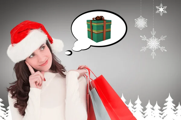 Festive brunette holding shopping bags — Stock Photo, Image