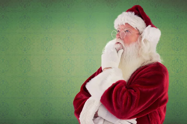 Weihnachtsmann denkt über etwas nach — Stockfoto