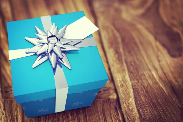 A blue Christmas gift with ribbon — Stock Photo, Image