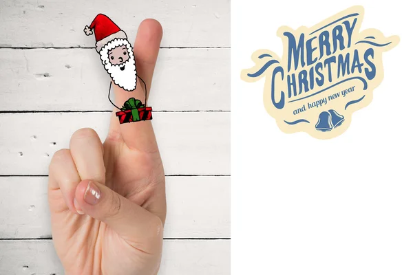 Composite image of christmas fingers — Stock Photo, Image