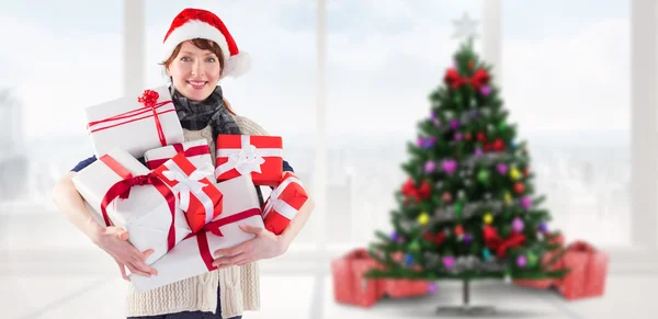 Woman holding lots of presents — Stock Photo, Image