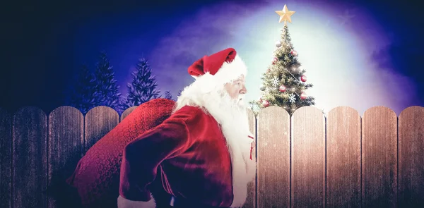 Babbo Natale salta con borsa — Foto Stock