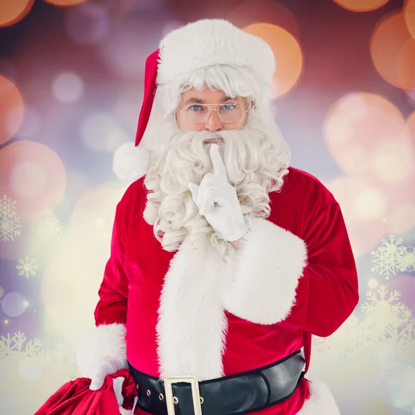 Santa pidiendo silencio con bolsa —  Fotos de Stock