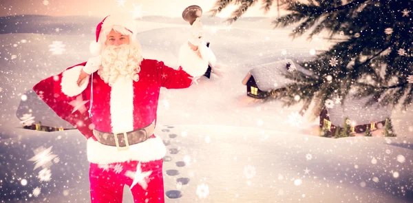 Santa claus celebración saco y campana — Foto de Stock