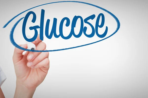 Glucose against female hand holding marker — Stock Photo, Image