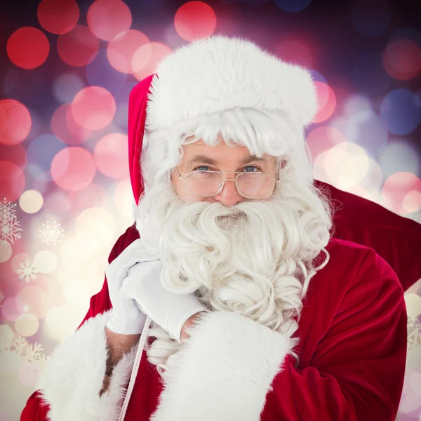 Happy santa claus houden zijn zak — Stockfoto