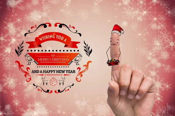 Menschlicher Finger mit Weihnachtsmütze — Stockfoto