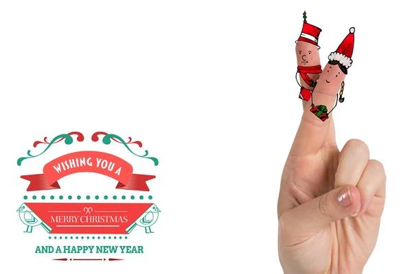 Menschliche Finger mit Weihnachtsmützen — Stockfoto