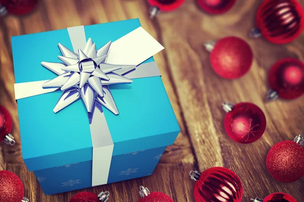 A blue Christmas gift with ribbon — Stock Photo, Image