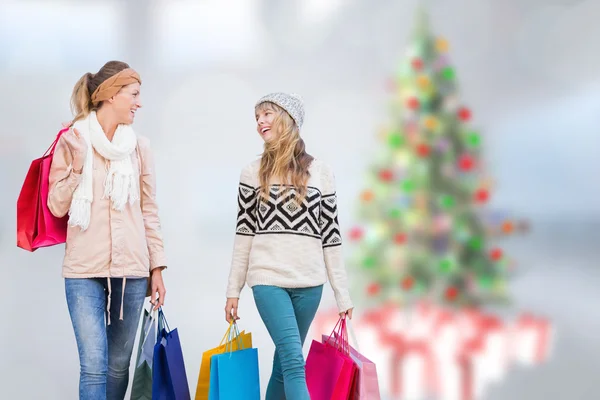 Beautiful women holding shopping bags — Stock Photo, Image