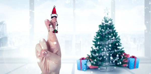 Composite image of christmas fingers — Stock Photo, Image