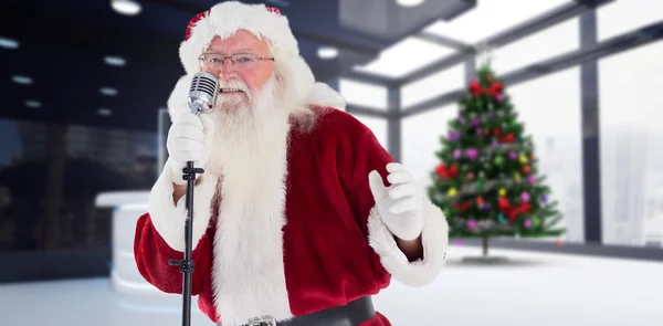 Santa claus is singing christmas songs — Stock Photo, Image