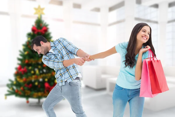 Pareja feliz con bolsa de compras —  Fotos de Stock