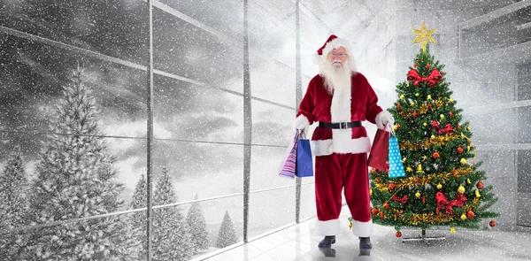 Santa carries some christmas bags — Stock Photo, Image