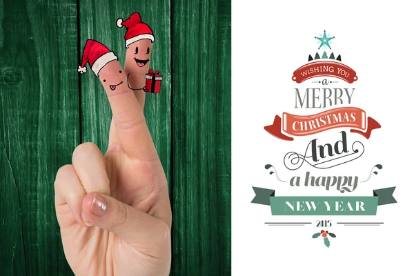 Samengestelde afbeelding van Kerstmis vingers — Stockfoto