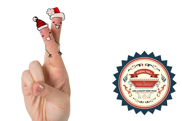 Christmas fingers against greetings — Stock Photo, Image