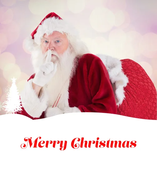 Papai Noel pedindo silêncio com saco — Fotografia de Stock
