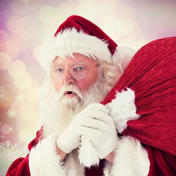 Santa takes care about sack Royalty Free Stock Photos