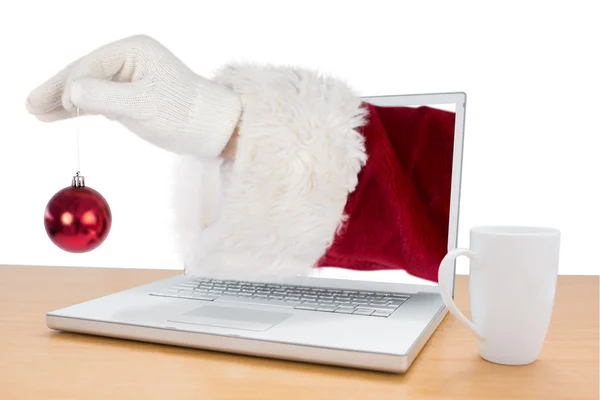 Santas hand is holding a Christmas bulb — Stock Photo, Image
