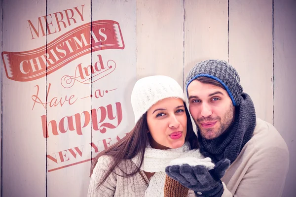 Composite image of young winter couple — Stock Photo, Image