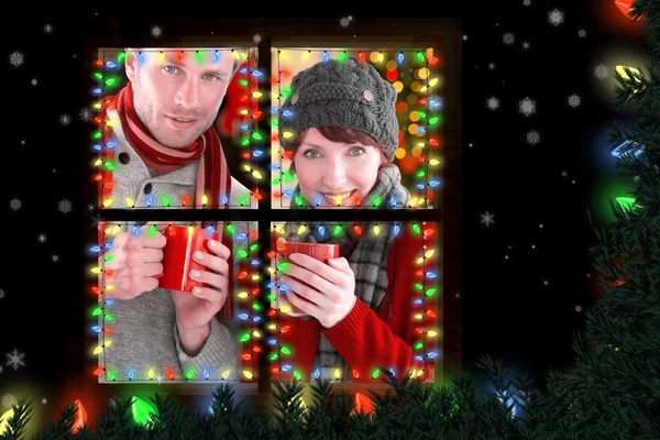 Couple both having warm drinks — Stock Photo, Image