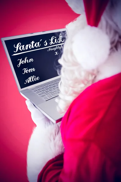 Weihnachtsmann mit seinem Laptop — Stockfoto