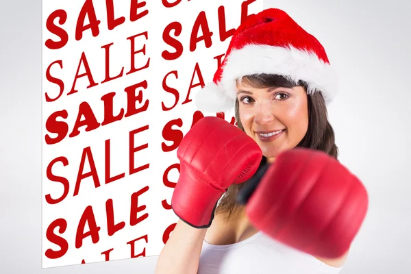 Festive brunette punching with boxing gloves — Stock Photo, Image