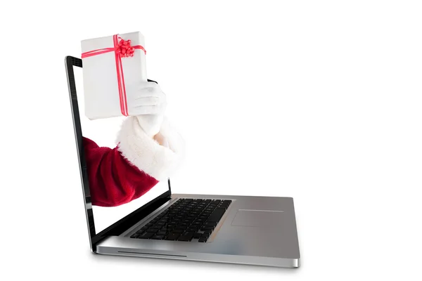 Santa shows a present — Stock Photo, Image