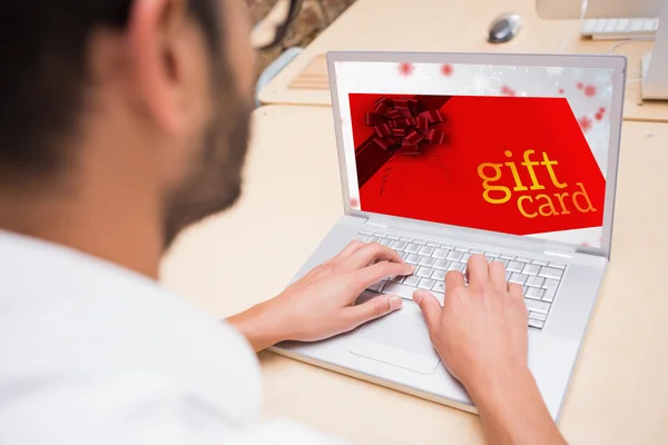 Composite image of gift card with festive bow — Stock Photo, Image