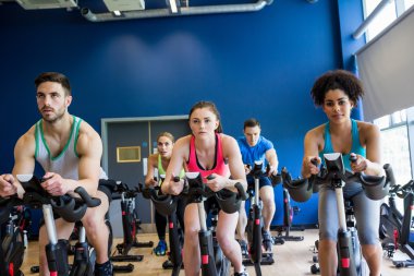 Fit people in a spin class clipart