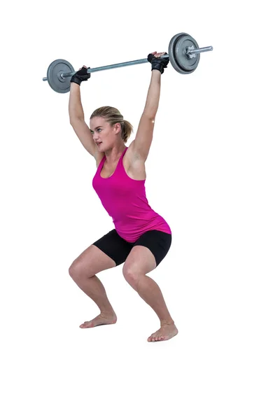 Female bodybuilder lifting barebell — Stock Photo, Image