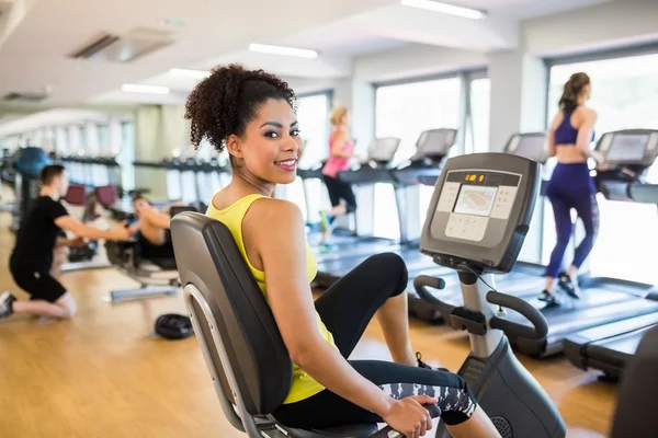 Fit people working out using machines — Stock Photo, Image