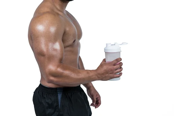 Muscular man with protein powder — Stock Photo, Image