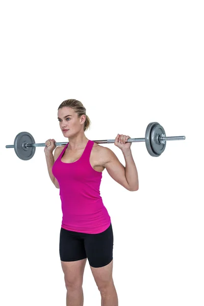 Sporty female bodybuilder lifting barebell — Stock Photo, Image